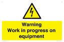 warning-work-in-progress-on-equipmentwith-electrical-hazard-symbol~